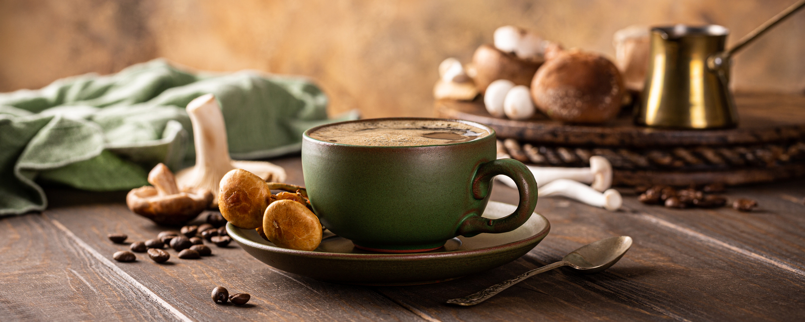 mushroom coffee in green cup on wooden background. New Superfood trendy healthy concept with copy space, selective focus. Mushroom Coffee